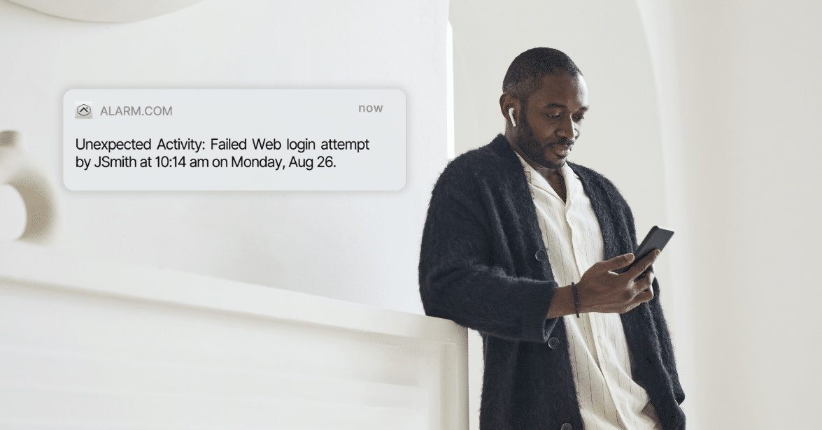 Alarm system notification showing failed web login attempt, with homeowner checking mobile device.