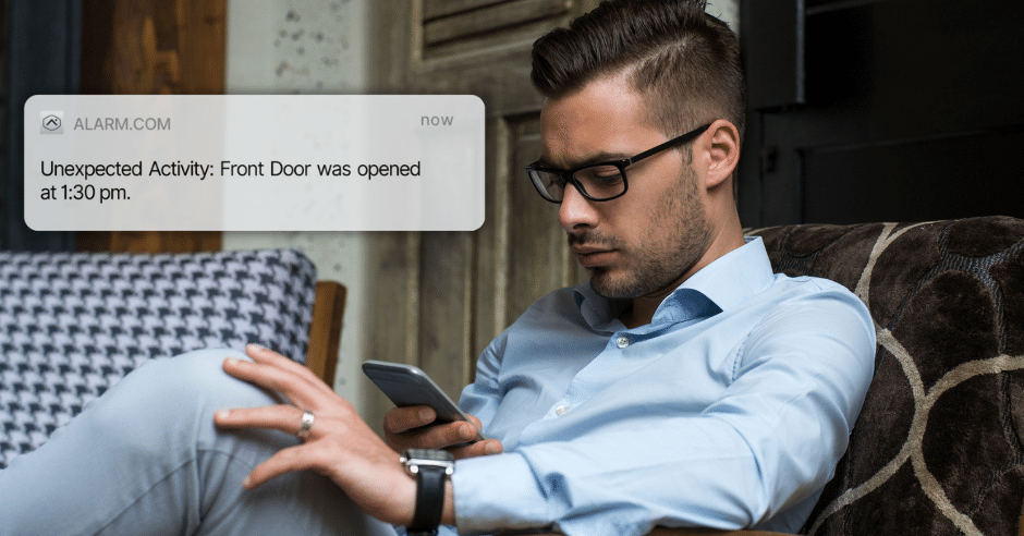Alarm system notification showing front door unexpectedly opened, with homeowner checking phone.
