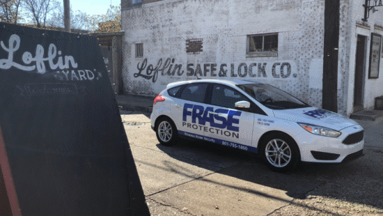 Frase Protection service vehicle parked in front of a Memphis business, highlighting local security services.