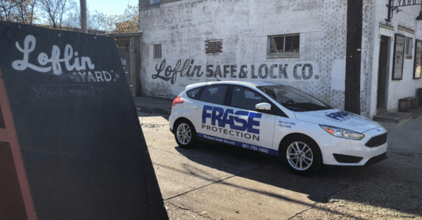 Frase Protection service vehicle parked in front of a Memphis business, highlighting local security services.