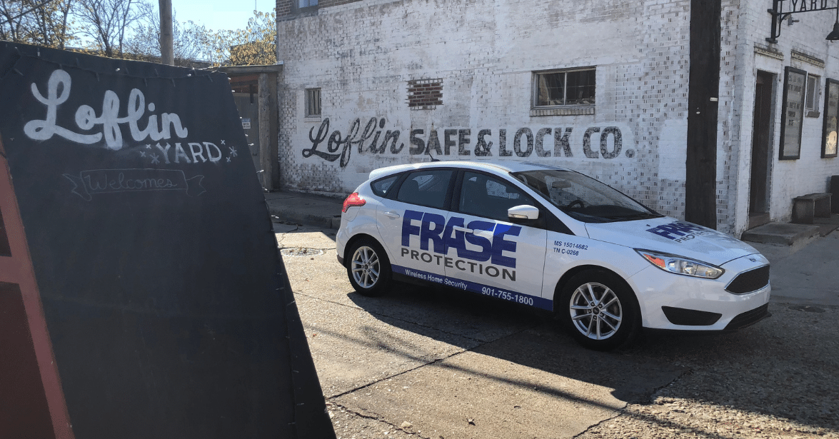 Frase Protection service vehicle parked in front of a Memphis business, highlighting local security services.