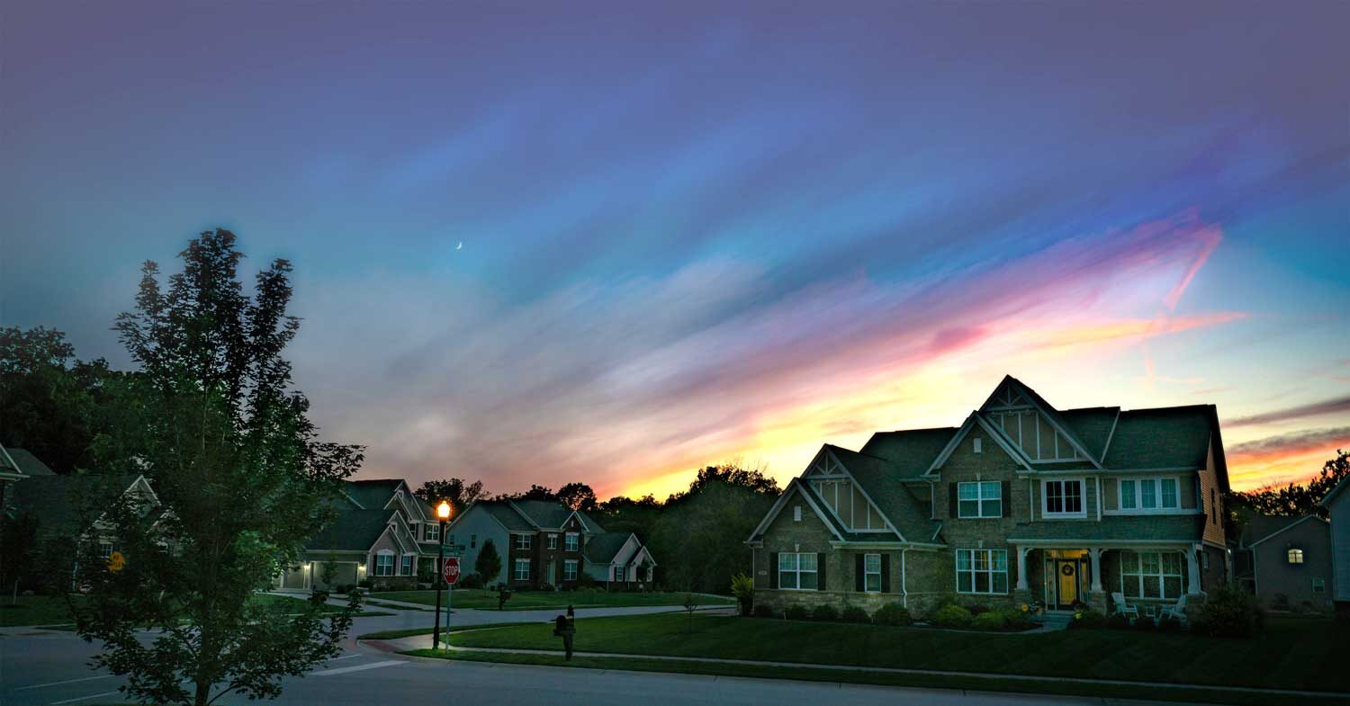 Residential home at dusk secured with Frase Protection home automation